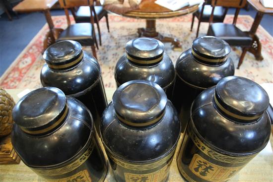 A set of six 19th century Toleware tea canisters,